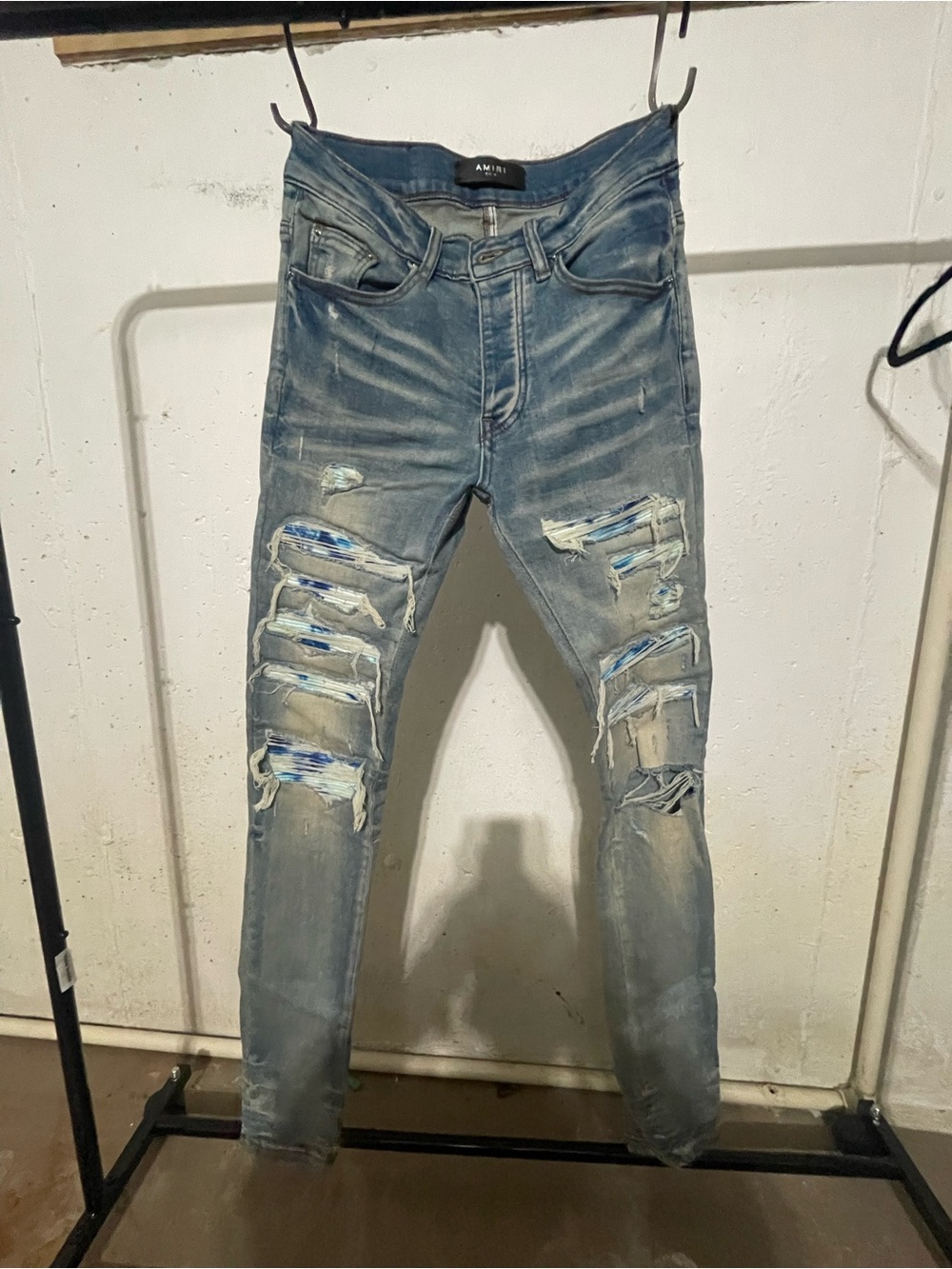 AMIRI Light Blue Skinny Distressed Jeans with Patch Detail